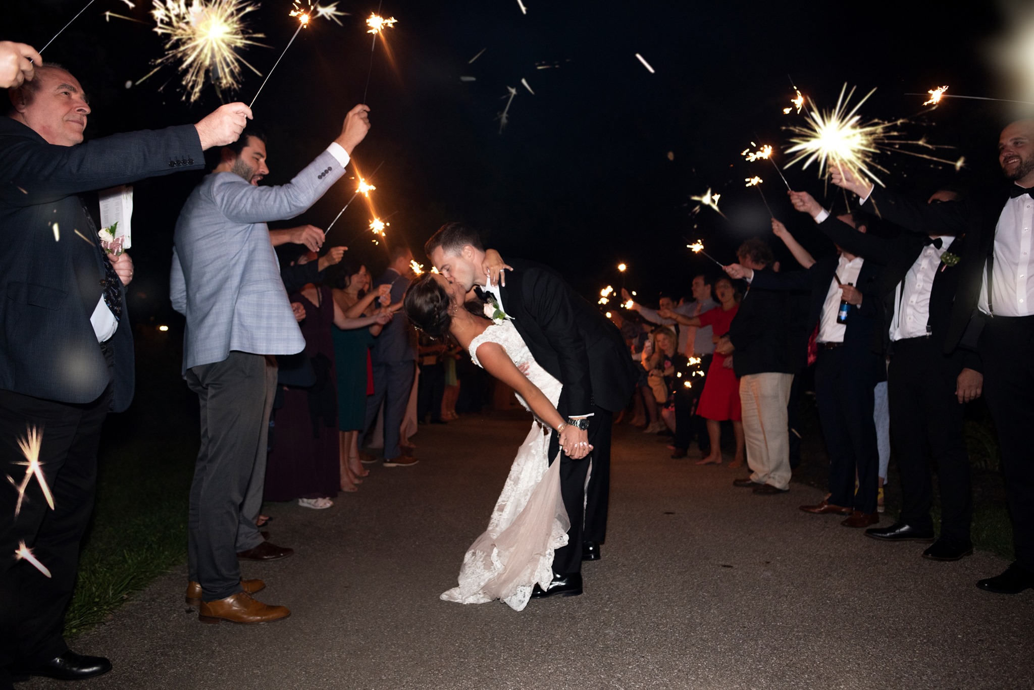 Couple Kissing at end of night send off Because of fun wedding dj